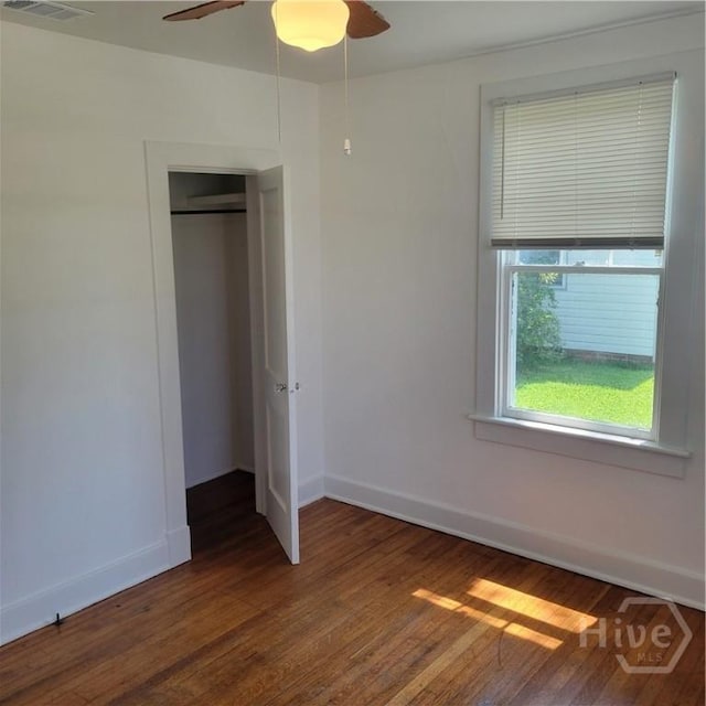 1214 Delesseps Ave, Savannah, GA 31404 - unfurnished bedroom featuring wood finished floors, baseboards, a closet, and a ceiling fan