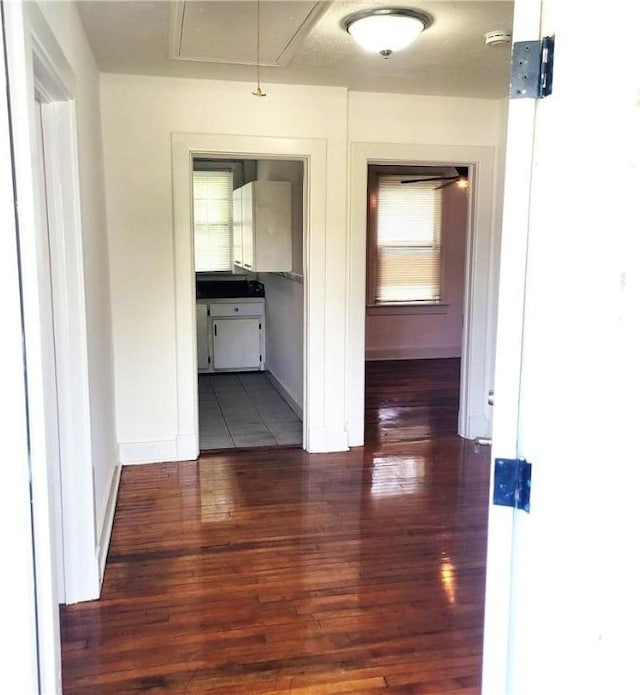 1214 Delesseps Ave, Savannah, GA 31404 - hallway with wood finished floors, attic access, and baseboards