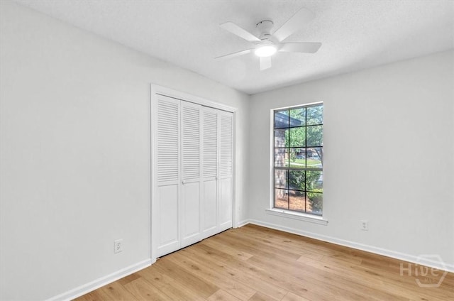 28 Red Fox Dr, Savannah, GA 31419 - unfurnished bedroom with light wood-style floors, baseboards, a closet, and ceiling fan