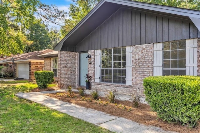 28 Red Fox Dr, Savannah, GA 31419 - view of front of property featuring an attached garage, brick siding, and board and batten siding