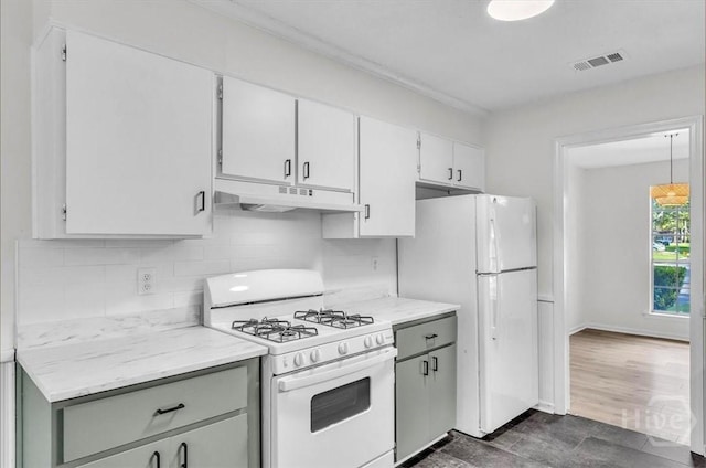 28 Red Fox Dr, Savannah, GA 31419 - kitchen featuring white appliances, under cabinet range hood, decorative backsplash, white cabinetry, and dark wood-type flooring