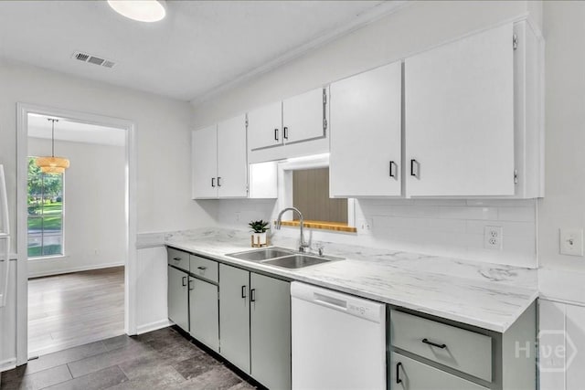 28 Red Fox Dr, Savannah, GA 31419 - kitchen with dishwasher, a sink, backsplash, and white cabinets