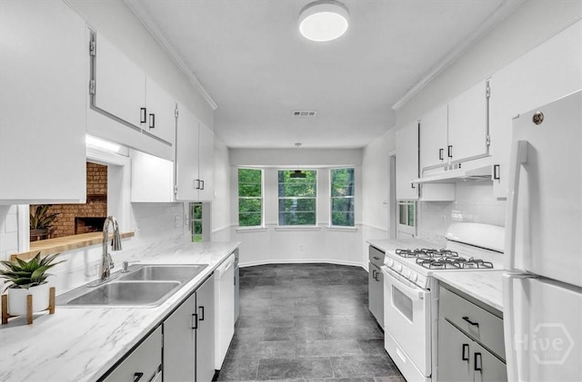 28 Red Fox Dr, Savannah, GA 31419 - kitchen featuring white appliances, a sink, under cabinet range hood, tasteful backsplash, and white cabinetry