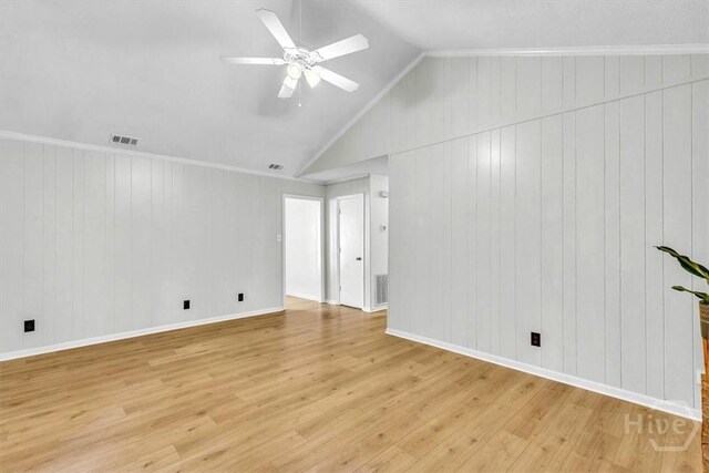 28 Red Fox Dr, Savannah, GA 31419 - empty room with light wood-type flooring, lofted ceiling, a ceiling fan, baseboards, and wooden walls
