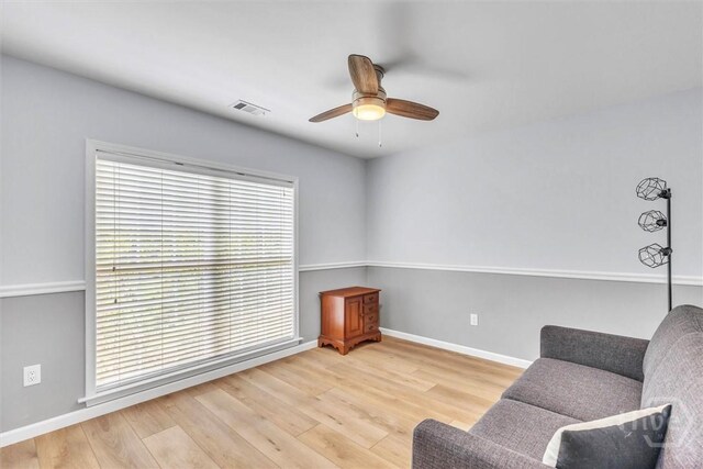 150 Laurenburg Dr, Richmond Hill, GA 31324 - living area featuring ceiling fan, wood finished floors, and baseboards