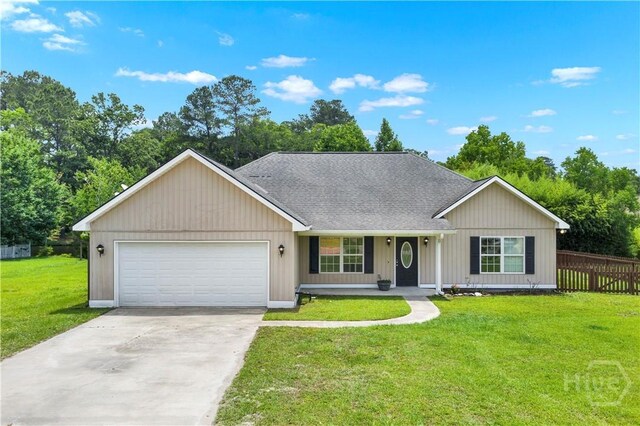 29 Joy Ln, Midway, GA 31320 - view of front of house featuring a garage, concrete driveway, a porch, and a shingled roof