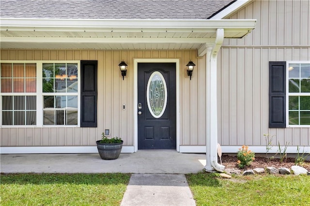29 Joy Ln, Midway, GA 31320 - view of exterior entry featuring a shingled roof and covered porch