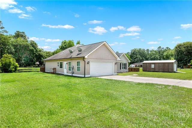 29 Joy Ln, Midway, GA 31320 - view of front of property featuring driveway, a front yard, an attached garage, and view of wooded area