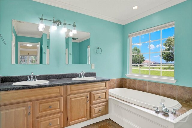 29 Joy Ln, Midway, GA 31320 - bathroom featuring a bath, double vanity, plenty of natural light, crown molding, and tile patterned flooring