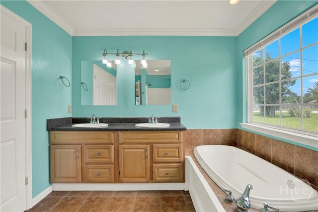 29 Joy Ln, Midway, GA 31320 - bathroom featuring plenty of natural light, a bath, double vanity, and crown molding