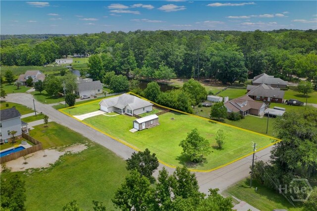 29 Joy Ln, Midway, GA 31320 - aerial perspective of suburban area with property parcel outlined and a heavily wooded area