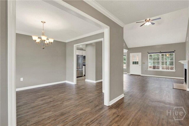 29 Joy Ln, Midway, GA 31320 - unfurnished living room featuring baseboards, dark wood-style flooring, a chandelier, a ceiling fan, and lofted ceiling
