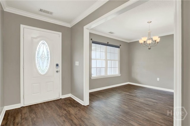 29 Joy Ln, Midway, GA 31320 - entrance foyer with a chandelier, dark wood-style floors, baseboards, and ornamental molding