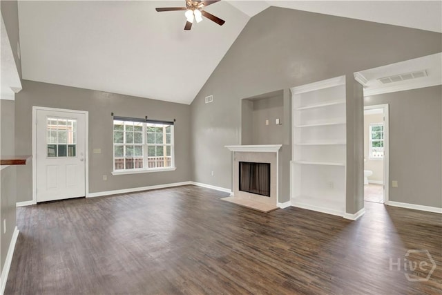 29 Joy Ln, Midway, GA 31320 - unfurnished living room with ceiling fan, high vaulted ceiling, a fireplace with flush hearth, dark wood-style flooring, and baseboards