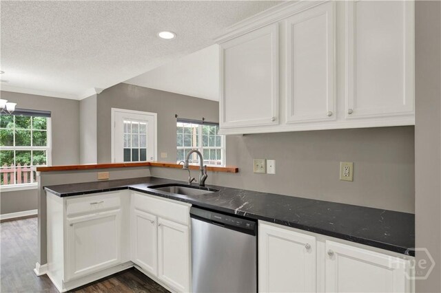 29 Joy Ln, Midway, GA 31320 - kitchen with stainless steel dishwasher, a sink, dark wood-type flooring, white cabinets, and a textured ceiling