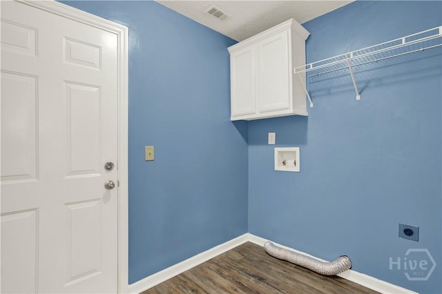 29 Joy Ln, Midway, GA 31320 - washroom featuring electric dryer hookup, cabinet space, dark wood-style floors, baseboards, and hookup for a washing machine