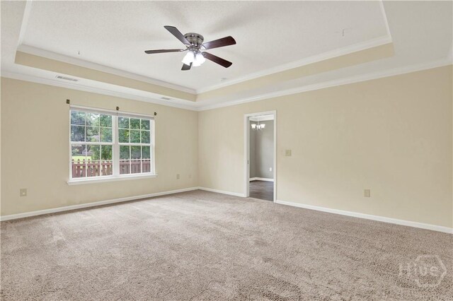 29 Joy Ln, Midway, GA 31320 - unfurnished room featuring a tray ceiling, ornamental molding, carpet flooring, a ceiling fan, and baseboards