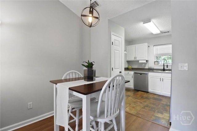 310 Tibet Ave Unit 10, Savannah, GA 31406 - dining room with baseboards and a textured ceiling