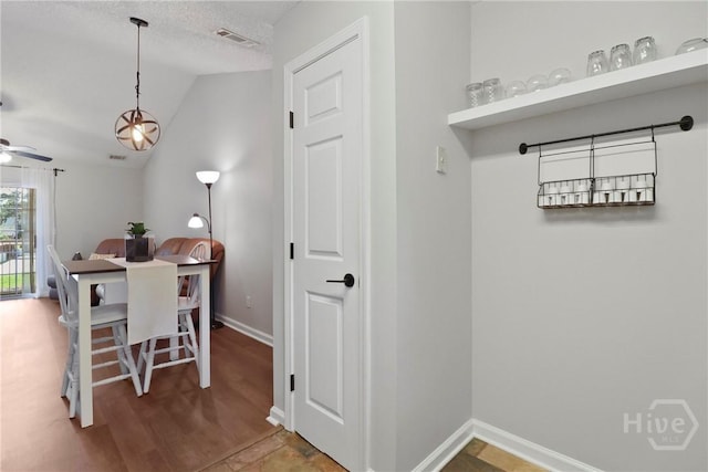 310 Tibet Ave Unit 10, Savannah, GA 31406 - dining area with lofted ceiling, a ceiling fan, baseboards, and wood finished floors