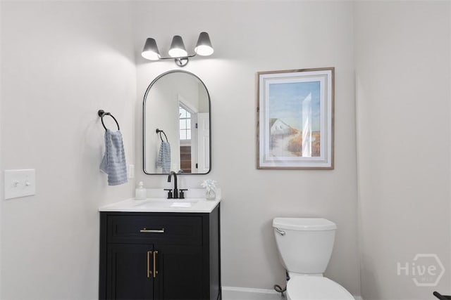 98 Picket Row, Savannah, GA 31410 - bathroom with toilet, vanity, and baseboards