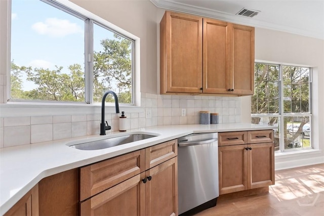 98 Picket Row, Savannah, GA 31410 - kitchen featuring dishwasher, a sink, decorative backsplash, light countertops, and plenty of natural light