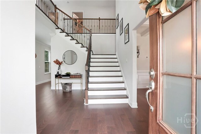 301 Highland Cir, Richmond Hill, GA 31324 - entryway featuring stairs, wood finished floors, baseboards, and a high ceiling