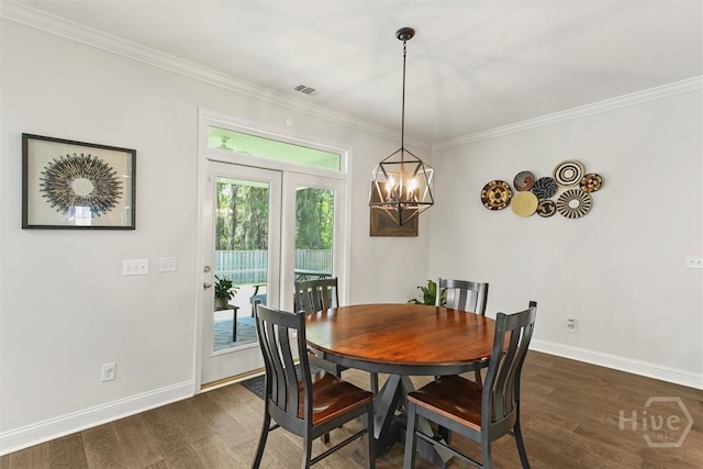301 Highland Cir, Richmond Hill, GA 31324 - dining space featuring ornamental molding, dark wood-style floors, baseboards, and a chandelier
