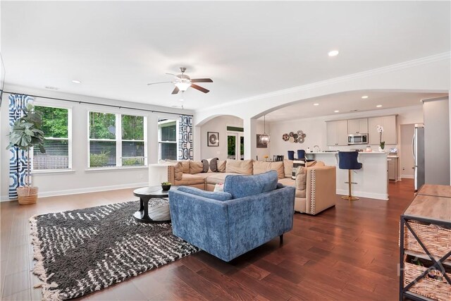 301 Highland Cir, Richmond Hill, GA 31324 - living area with arched walkways, a ceiling fan, crown molding, dark wood-type flooring, and recessed lighting