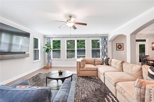 301 Highland Cir, Richmond Hill, GA 31324 - living room featuring arched walkways, ceiling fan, crown molding, baseboards, and recessed lighting