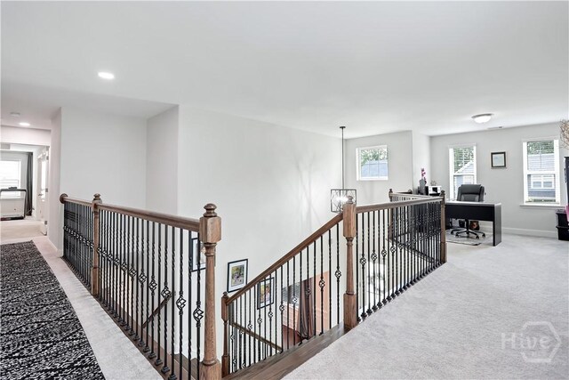 301 Highland Cir, Richmond Hill, GA 31324 - hall featuring an upstairs landing, light colored carpet, baseboards, and recessed lighting