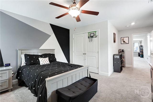 301 Highland Cir, Richmond Hill, GA 31324 - carpeted bedroom featuring baseboards, a closet, and a ceiling fan
