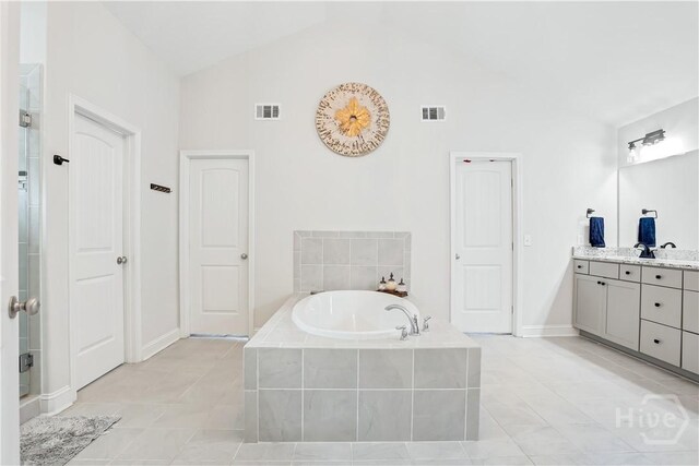301 Highland Cir, Richmond Hill, GA 31324 - bathroom with vanity, a bath, tile patterned floors, high vaulted ceiling, and a shower with shower door