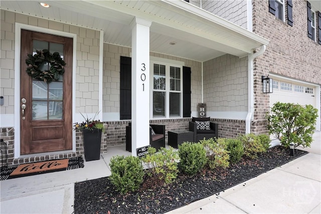 301 Highland Cir, Richmond Hill, GA 31324 - doorway to property featuring a porch and brick siding