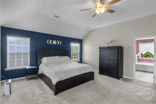 26 Sunflower Cir NE, Ludowici, GA 31316 - carpeted bedroom with vaulted ceiling, multiple windows, baseboards, ceiling fan, and a textured ceiling