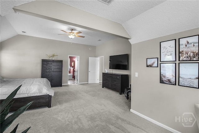 26 Sunflower Cir NE, Ludowici, GA 31316 - bedroom featuring vaulted ceiling, a textured ceiling, baseboards, light carpet, and ensuite bath