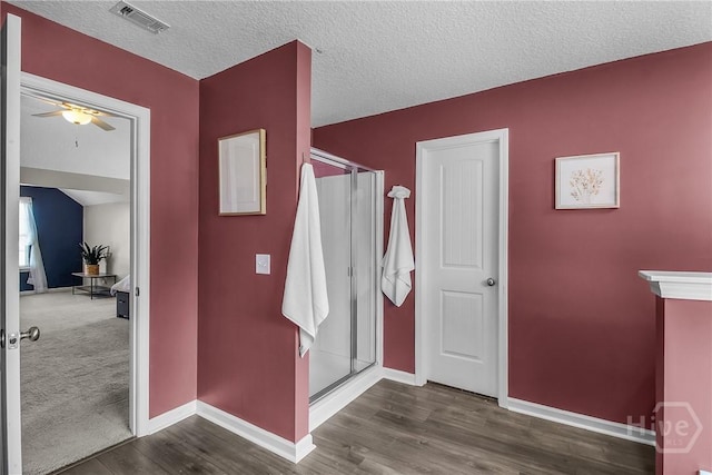 26 Sunflower Cir NE, Ludowici, GA 31316 - full bathroom with ceiling fan, baseboards, a stall shower, and a textured ceiling