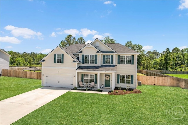 26 Sunflower Cir NE, Ludowici, GA 31316 - view of front of property featuring concrete driveway, an attached garage, and central air condition unit