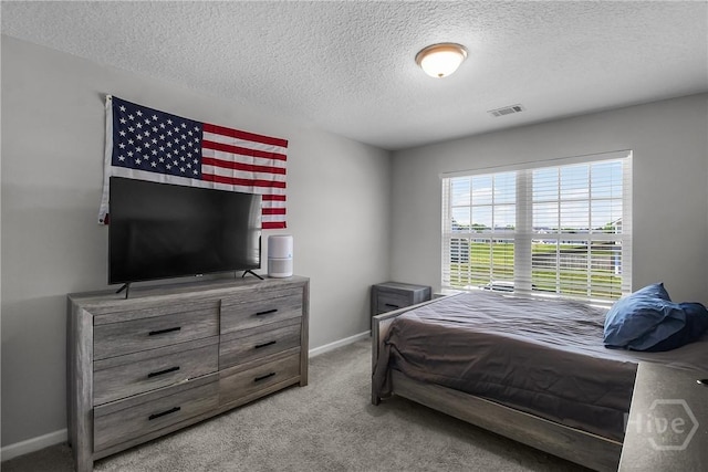 26 Sunflower Cir NE, Ludowici, GA 31316 - carpeted bedroom featuring a textured ceiling and baseboards