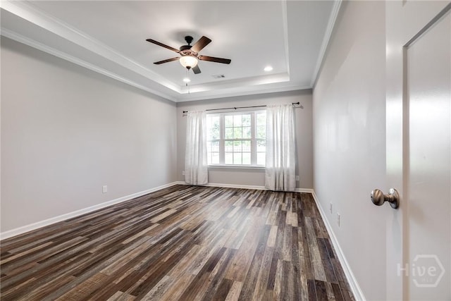 447 Nease Rd, Guyton, GA 31312 - empty room featuring a raised ceiling, dark wood finished floors, a ceiling fan, crown molding, and baseboards