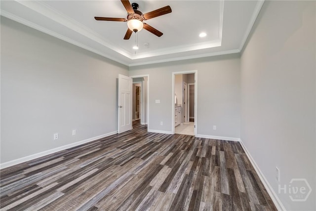 447 Nease Rd, Guyton, GA 31312 - unfurnished bedroom featuring dark wood-style flooring, a raised ceiling, baseboards, recessed lighting, and crown molding