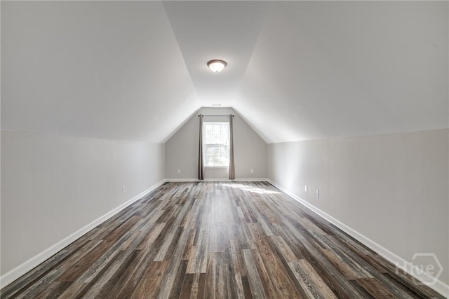 447 Nease Rd, Guyton, GA 31312 - bonus room featuring dark wood-style floors, vaulted ceiling, and baseboards