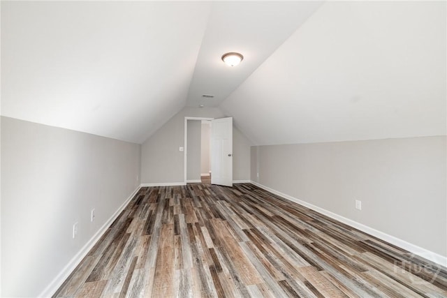 447 Nease Rd, Guyton, GA 31312 - additional living space featuring wood finished floors, vaulted ceiling, and baseboards