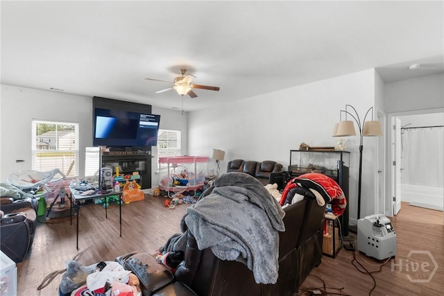 108 Franklins Walk, Rincon, GA 31326 - living room featuring ceiling fan, wood finished floors, and a glass covered fireplace