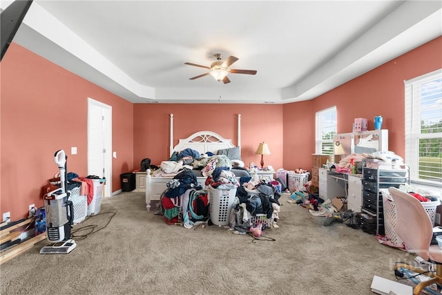 108 Franklins Walk, Rincon, GA 31326 - bedroom with carpet, a tray ceiling, and ceiling fan