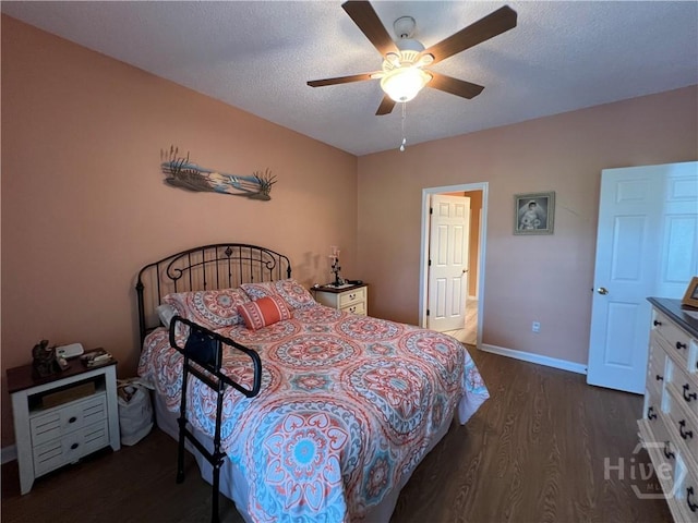 103 Travertine Cir, Savannah, GA 31419 - bedroom with dark wood finished floors, baseboards, ceiling fan, and a textured ceiling