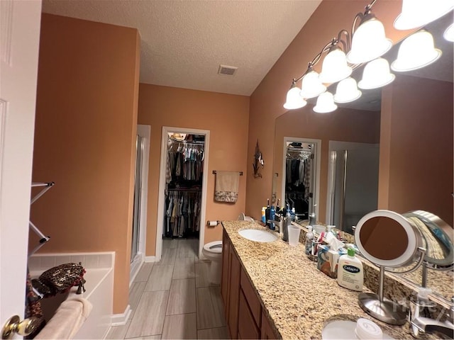 103 Travertine Cir, Savannah, GA 31419 - full bathroom featuring a walk in closet, a shower stall, toilet, a chandelier, and double vanity
