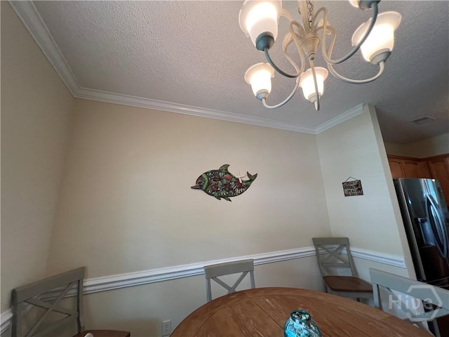 103 Travertine Cir, Savannah, GA 31419 - dining room with a chandelier, crown molding, and a textured ceiling
