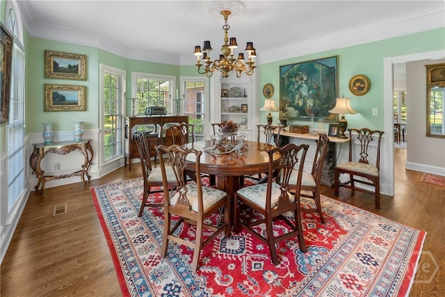 320 Wedgefield Xing, Savannah, GA 31405 - dining room with a chandelier, ornamental molding, wood finished floors, and built in shelves