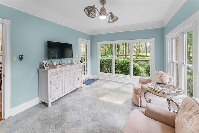 320 Wedgefield Xing, Savannah, GA 31405 - living area featuring baseboards, crown molding, and light stone finish flooring