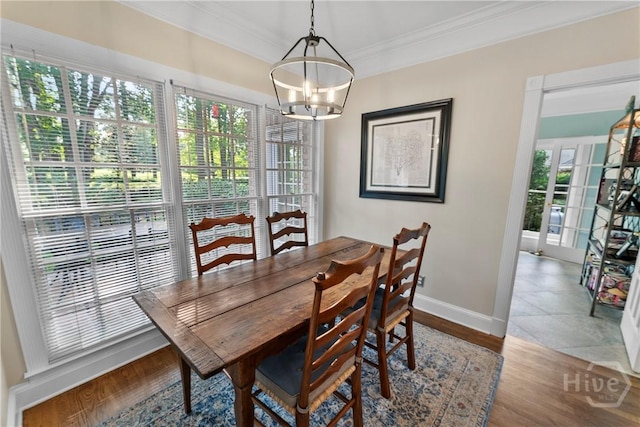 320 Wedgefield Xing, Savannah, GA 31405 - dining area with crown molding, baseboards, a chandelier, and wood finished floors